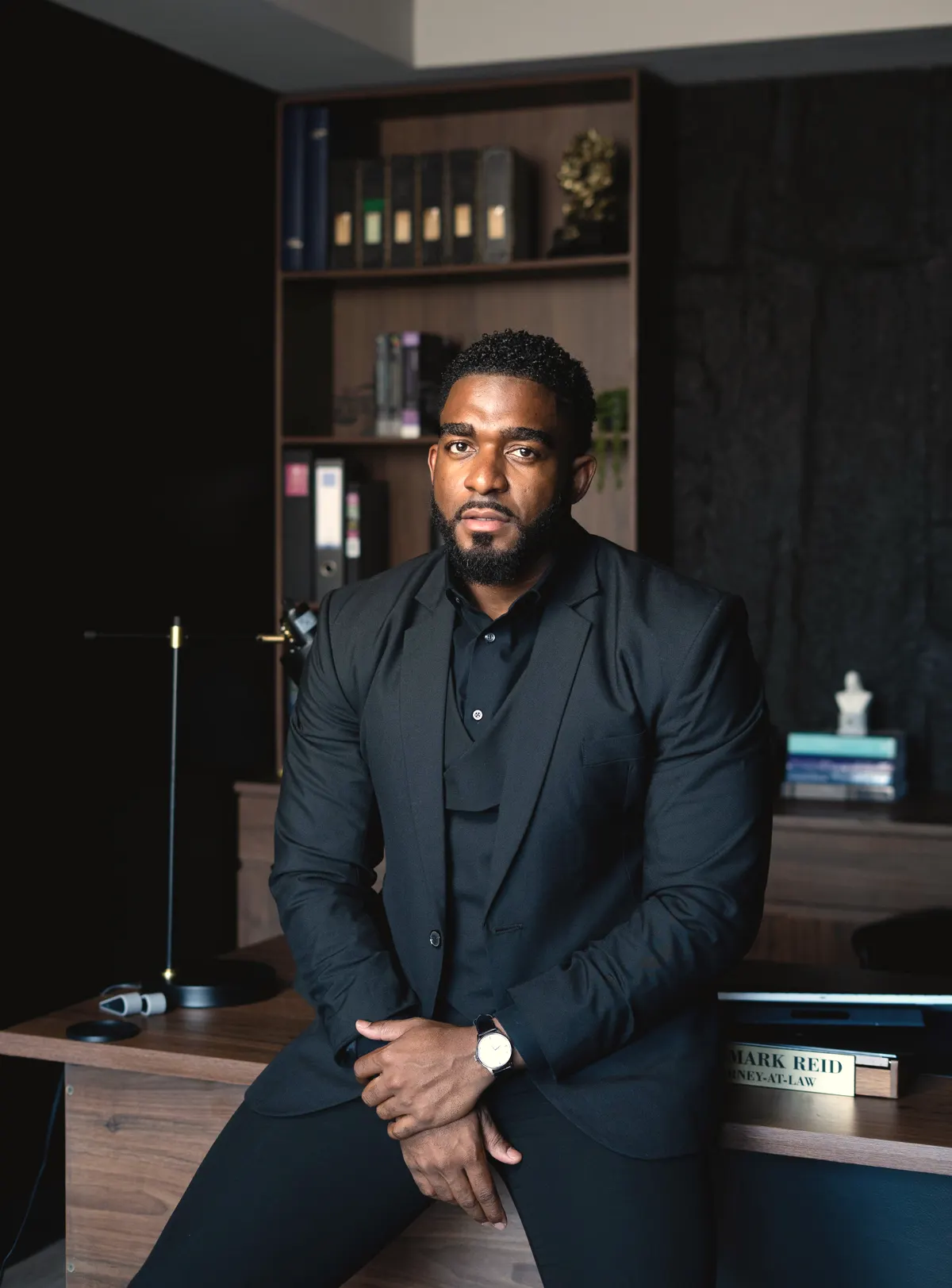 John-Mark D. Reid, Attorney-at-Law, seated at his desk in chambers